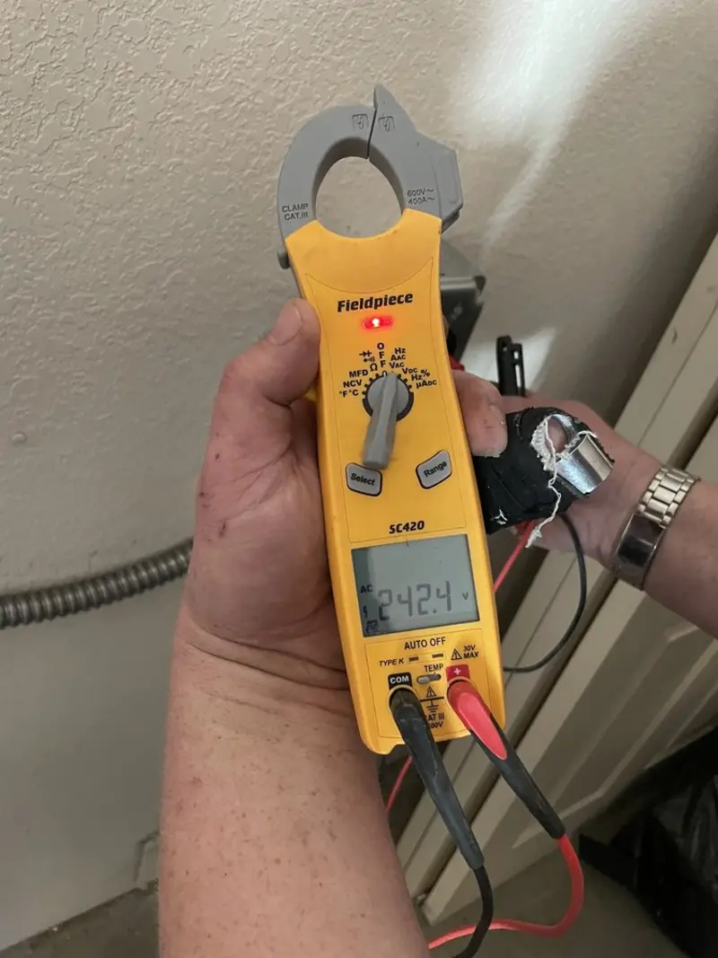 Voltage testing with clamp meter during Electrical Installation Services in Silver Springs